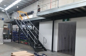 A picture of a black structural mezzanine floor in a warehouse.