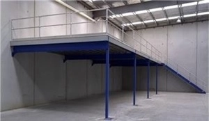 A picture of a blue structural mezzanine floor in a warehouse.