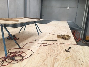 Laying floor boards on a single-level mezzanine in Melbourne.