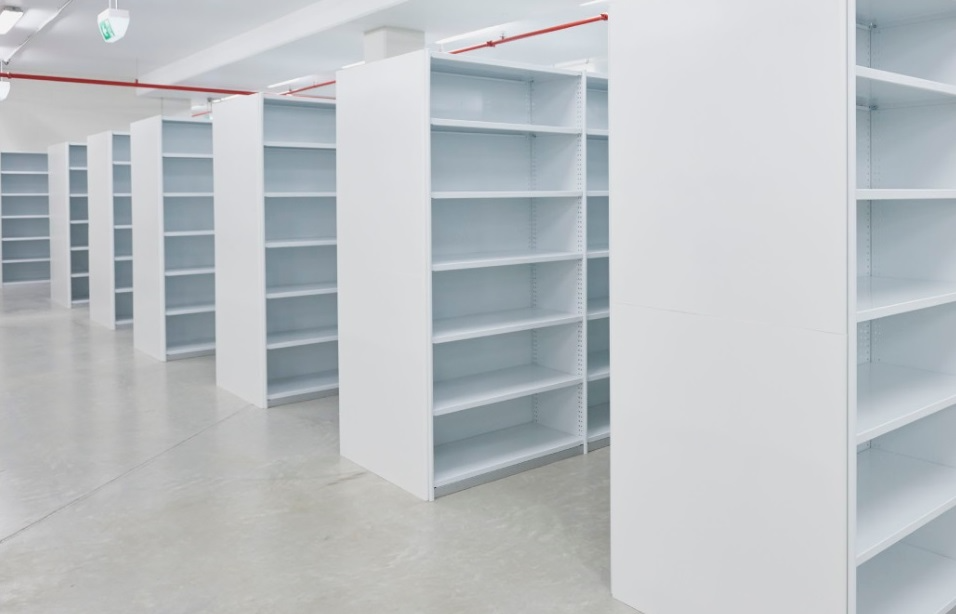 Large off-white coloured Steel RUT Shelving system with 6 storage levels in each bay.